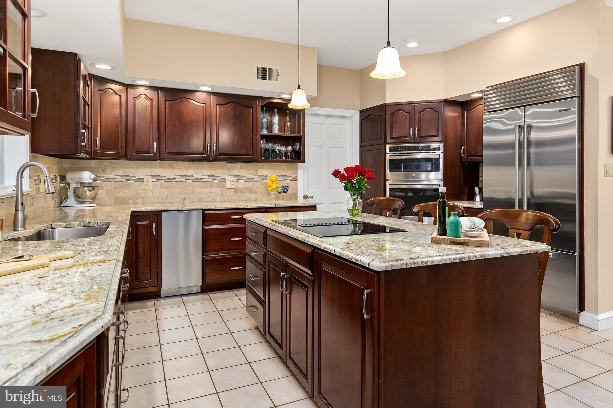 2 Teaberry Drive Medford, NJ 08055 - Photo 10 of 43 a kitchen with kitchen island granite countertop a sink stove and cabinets