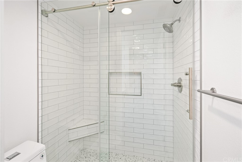 34026 Selva Road, Unit 65 Dana Point, CA 92629 - Photo 12 of 22 a bathroom with a shower and toilet
