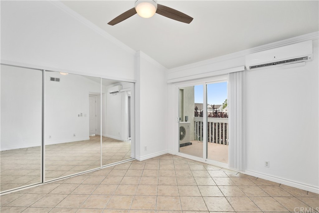 34026 Selva Road, Unit 65 Dana Point, CA 92629 - Photo 14 of 22 a view of a room with a ceiling fan & entryway