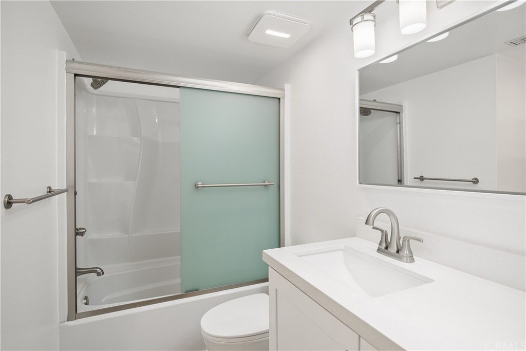 34026 Selva Road, Unit 65 Dana Point, CA 92629 - Photo 16 of 22 a bathroom with a sink a toilet and shower