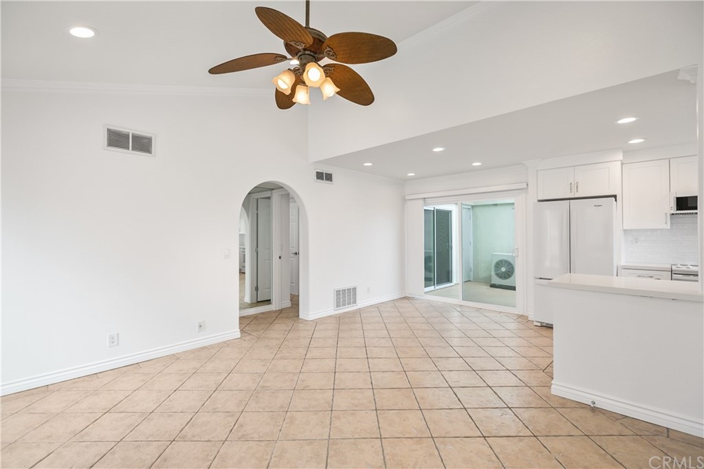 34026 Selva Road, Unit 65 Dana Point, CA 92629 - Photo 5 of 22 a view of a kitchen with a sink and a chandelier fan