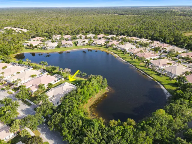 an aerial view of a house with a lake view