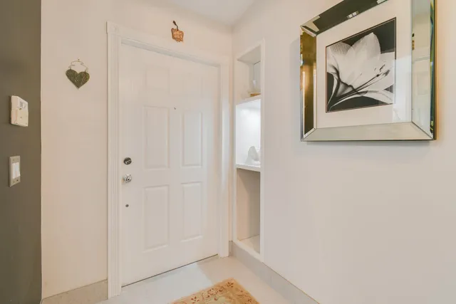 a bedroom with furniture and a flat screen tv