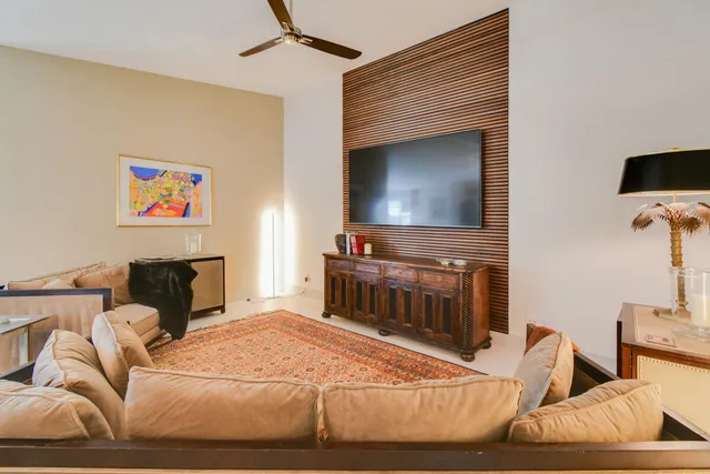 a kitchen with stainless steel appliances kitchen island granite countertop a sink stove and refrigerator