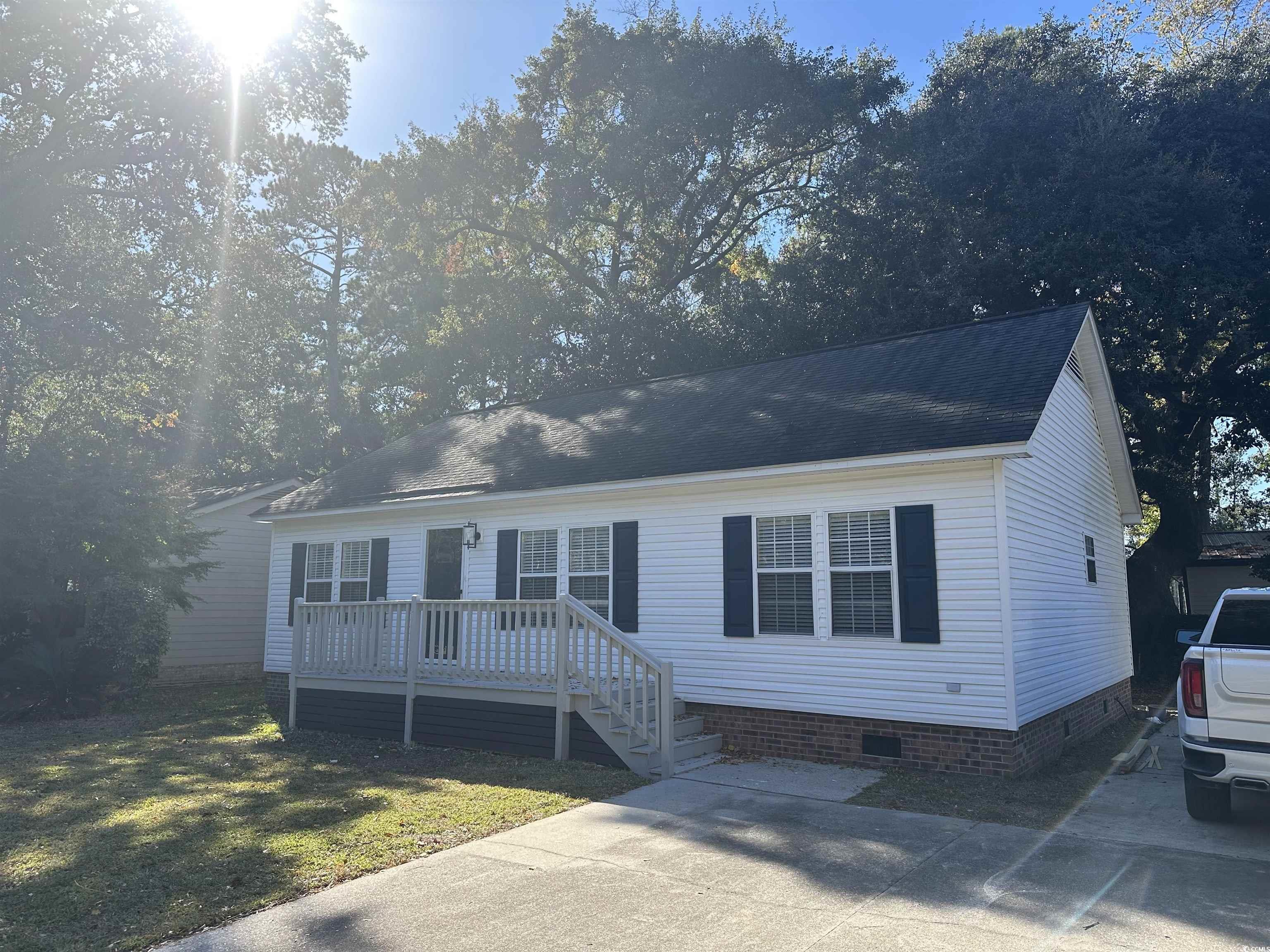 3800 Murrells Inlet Road Murrells Inlet, SC 29576 - Photo 1 of 22 View of front facade with a wooden deck, a front yard, and crawl space
