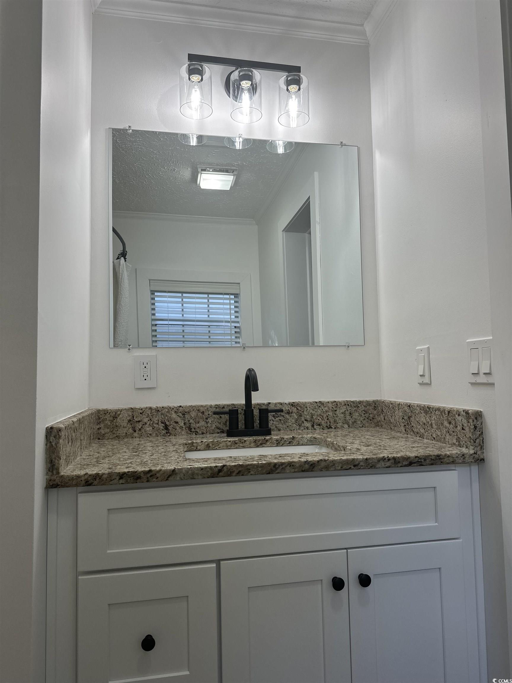 3800 Murrells Inlet Road Murrells Inlet, SC 29576 - Photo 13 of 22 Bathroom featuring vanity, ornamental molding, and a textured ceiling
