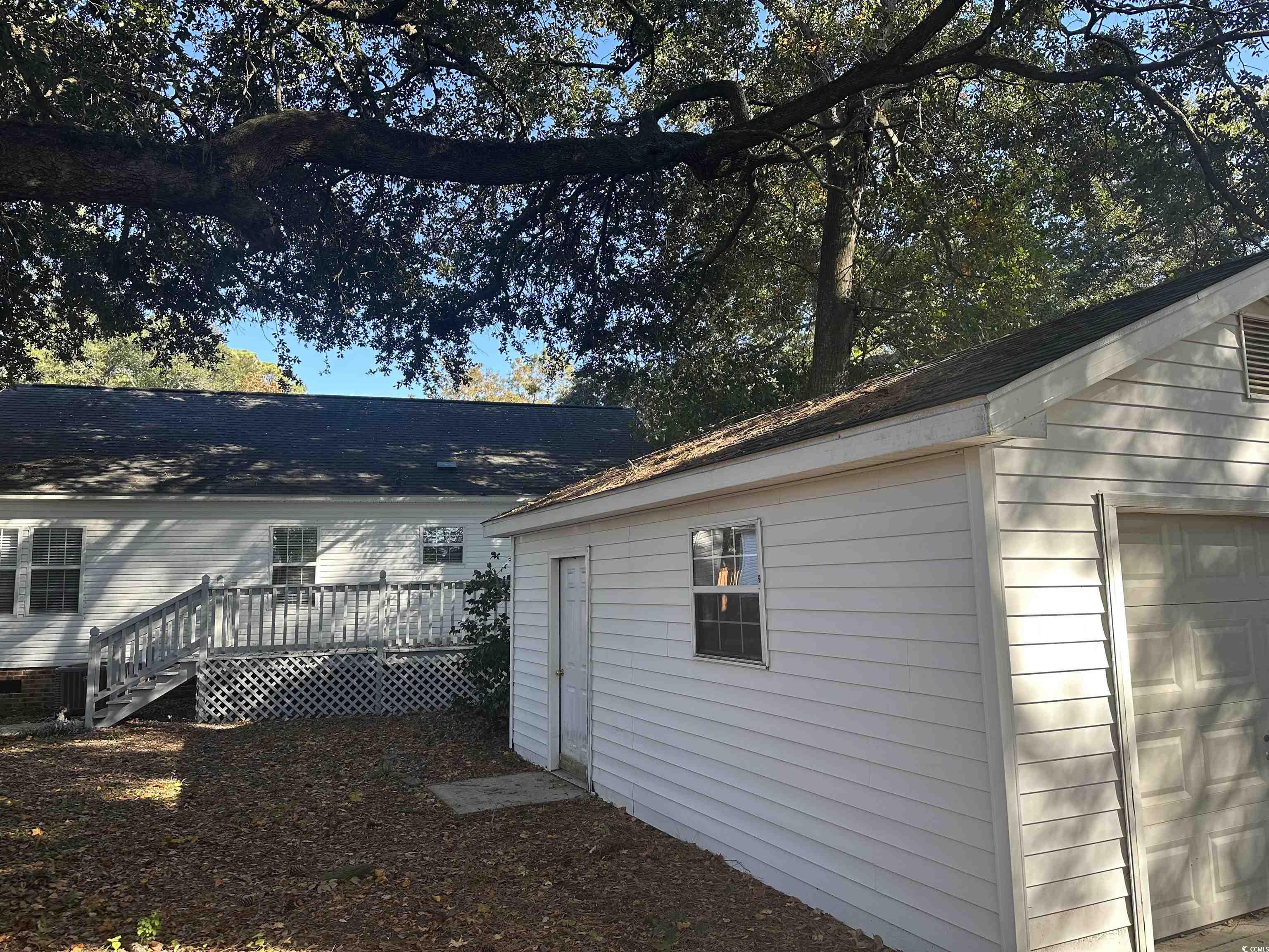 3800 Murrells Inlet Road Murrells Inlet, SC 29576 - Photo 16 of 22 View of side of home featuring an outbuilding and a deck