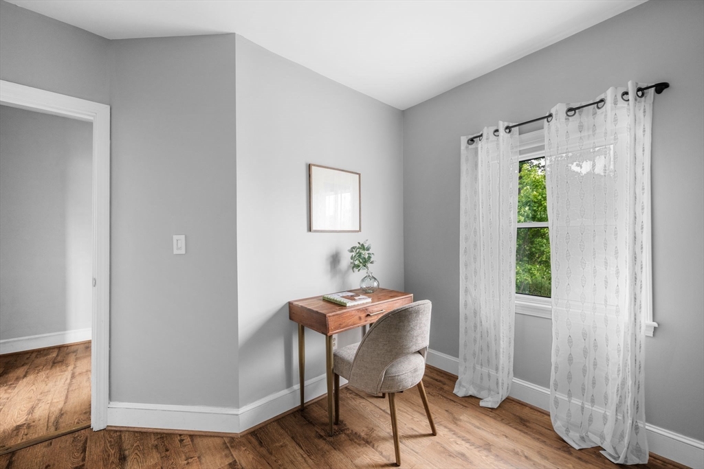 8 Baker Avenue Beverly, MA 01915 - Photo 26 of 40 a view of a workspace room with wooden floor table and chair