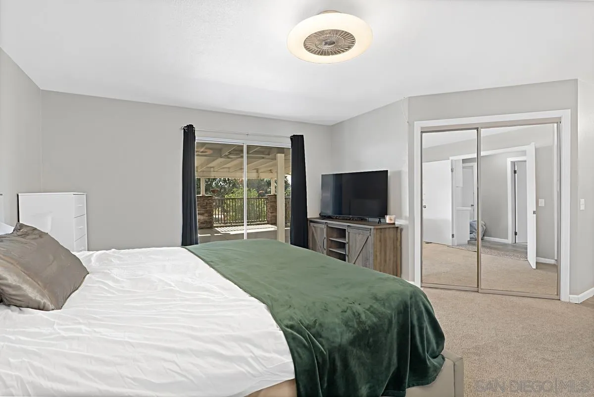 821 Steffy Road Ramona, CA 92065 - Photo 20 of 35 a bedroom with a bed and a flat screen tv