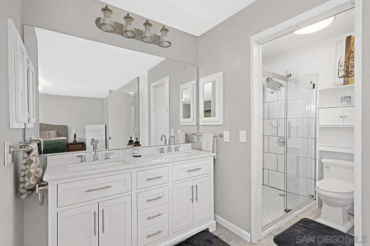 821 Steffy Road Ramona, CA 92065 - Photo 23 of 35 a bathroom with a sink a toilet and shower