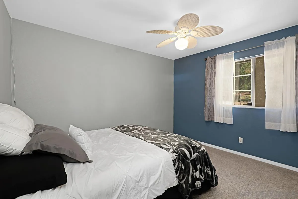 821 Steffy Road Ramona, CA 92065 - Photo 26 of 35 a bedroom with a bed and a window