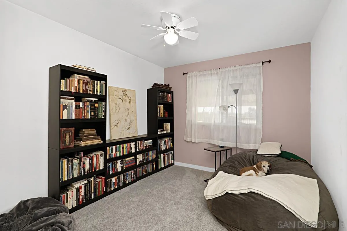 821 Steffy Road Ramona, CA 92065 - Photo 27 of 35 a living room with furniture cabinets and a book shelf