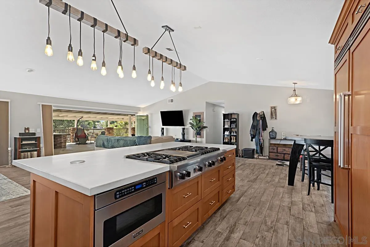 821 Steffy Road Ramona, CA 92065 - Photo 3 of 35 a kitchen with a stove and a table