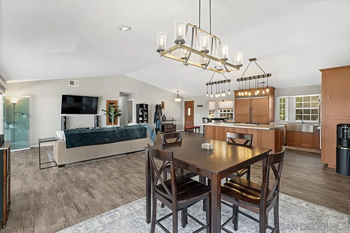 821 Steffy Road Ramona, CA 92065 - Photo 9 of 35 a view of a dining room with furniture and wooden floor