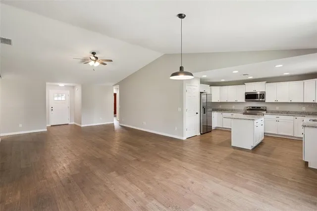 a view of kitchen and kitchen with sink