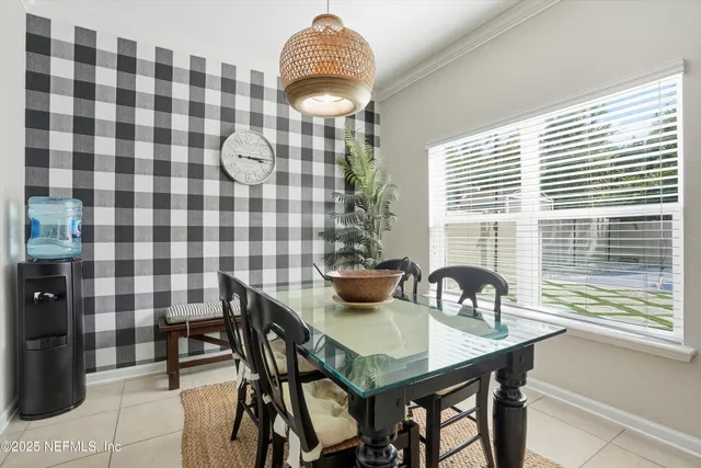 a view of a dining room with furniture and chandelier
