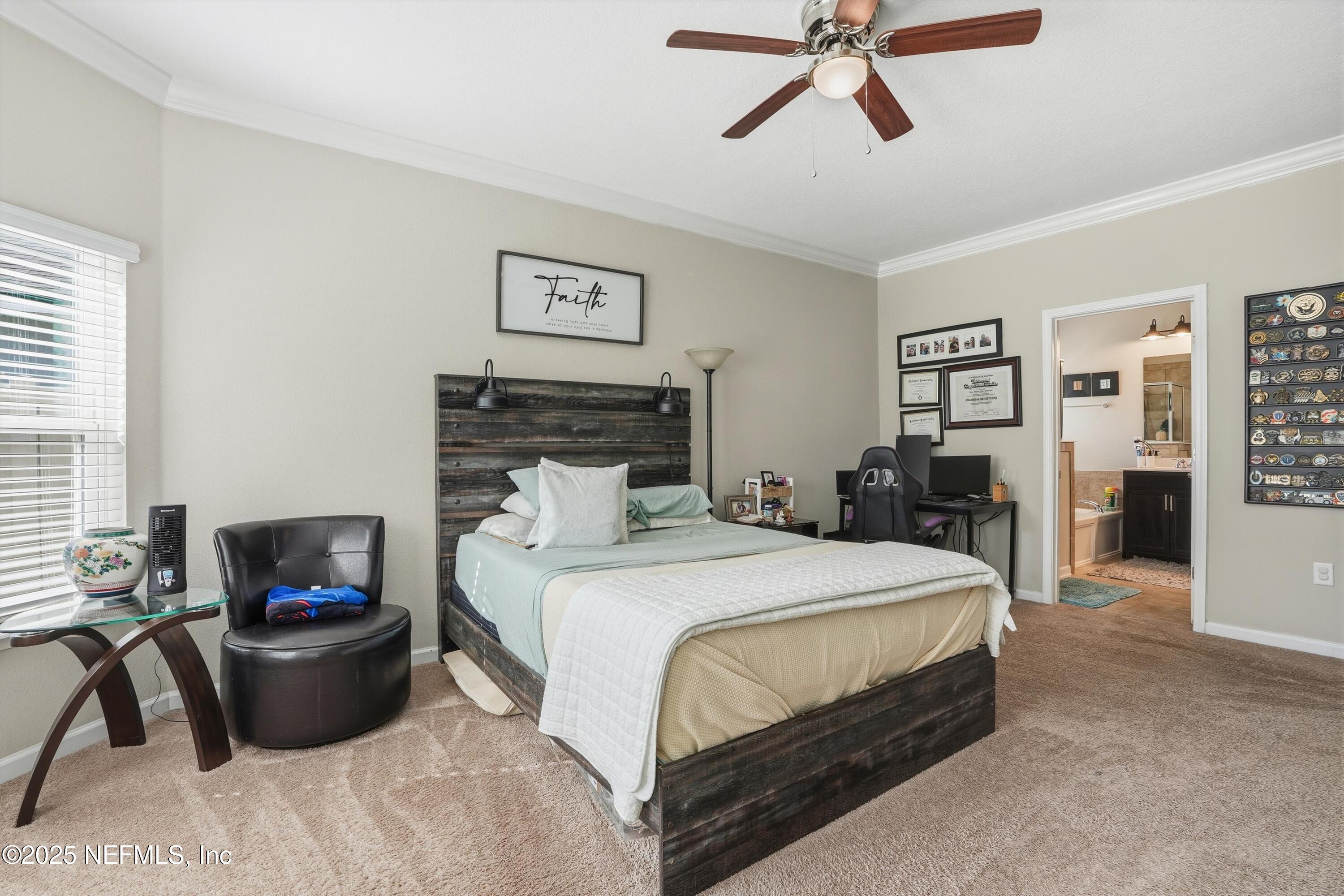 3884 Hammock Bluff Drive Jacksonville, FL 32226 - Photo 19 of 34 a bedroom with a bed and a couch