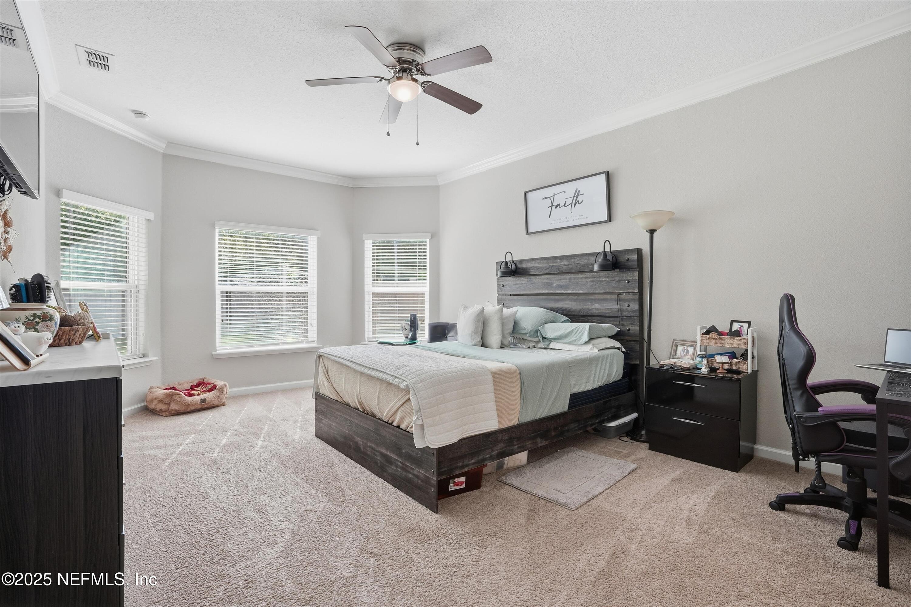 3884 Hammock Bluff Drive Jacksonville, FL 32226 - Photo 7 of 34 a bedroom with a bed gym equipment and a window