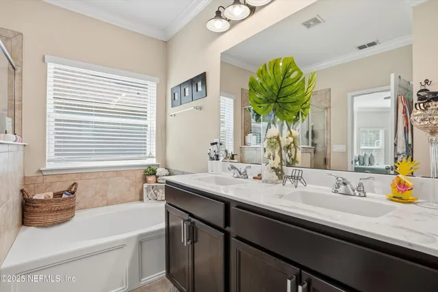 a bathroom with a sink a vanity and a mirror