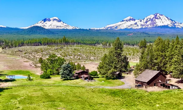 a view of a house with a yard and a table