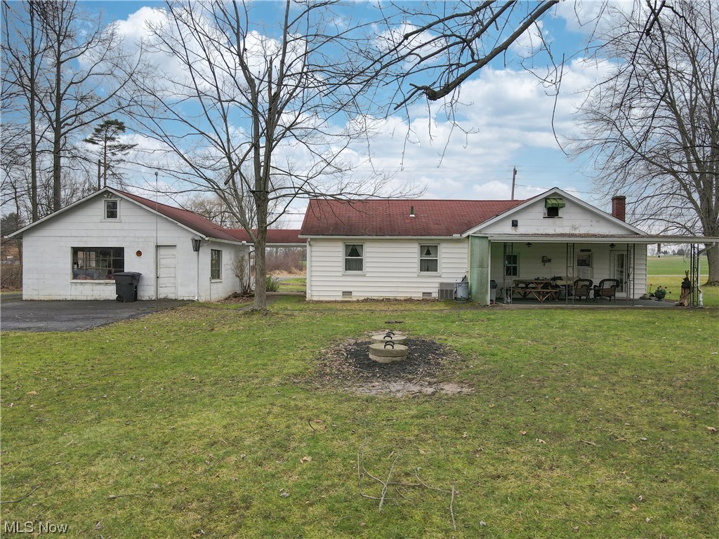 466 Pine Lake Road Sebring, OH 44672 - Photo 12 of 30 Rear view of property with a yard