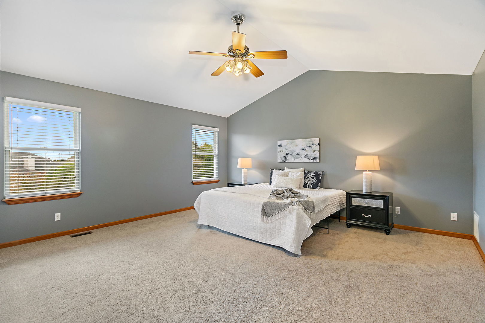 685 Persimmon Street DeKalb, IL 60115 - Photo 20 of 38 a bedroom with a bed and a chandelier