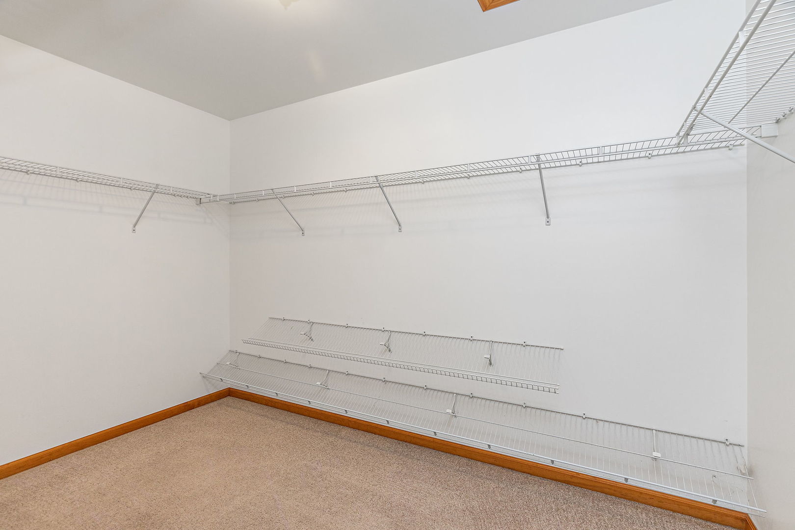 685 Persimmon Street DeKalb, IL 60115 - Photo 21 of 38 a view of a room with racks on the wall