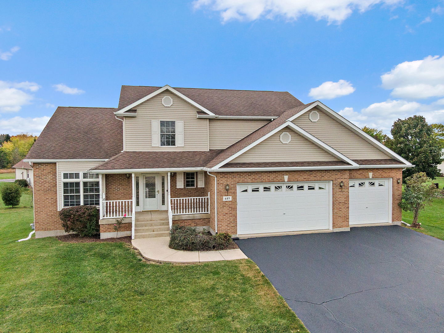 685 Persimmon Street DeKalb, IL 60115 - Photo 31 of 38 a view of a house with a yard