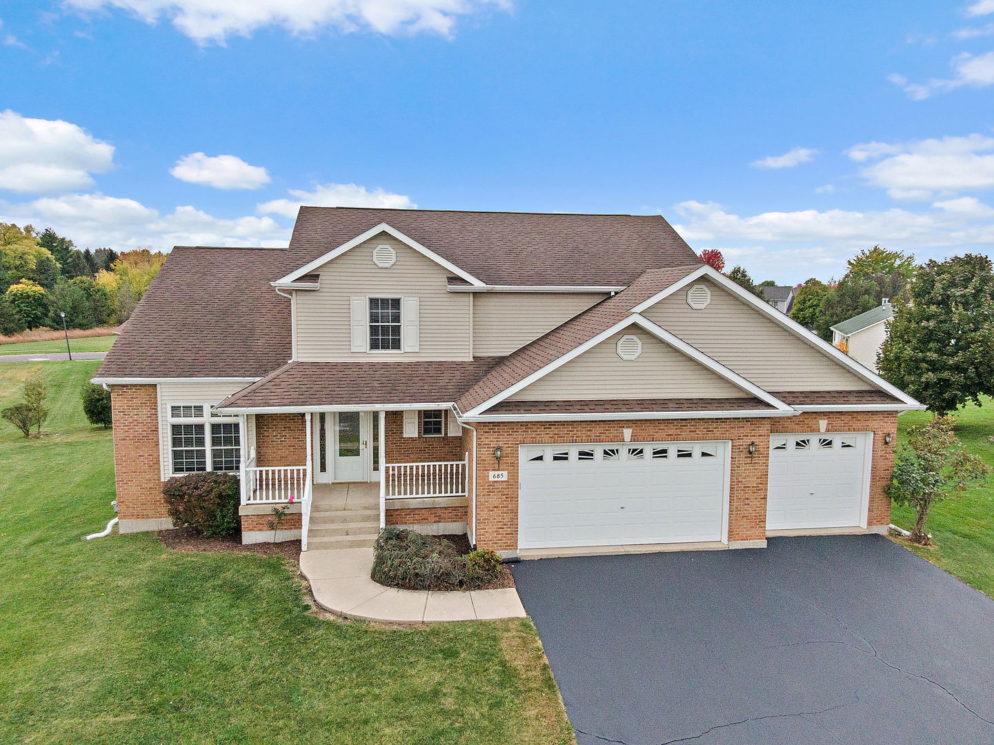 685 Persimmon Street DeKalb, IL 60115 - Photo 32 of 38 a front view of a house with garden