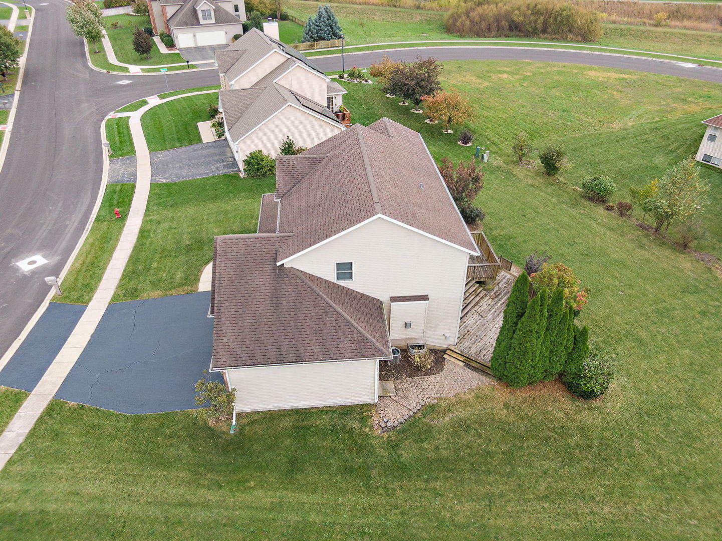 685 Persimmon Street DeKalb, IL 60115 - Photo 34 of 38 an aerial view of a house with a yard