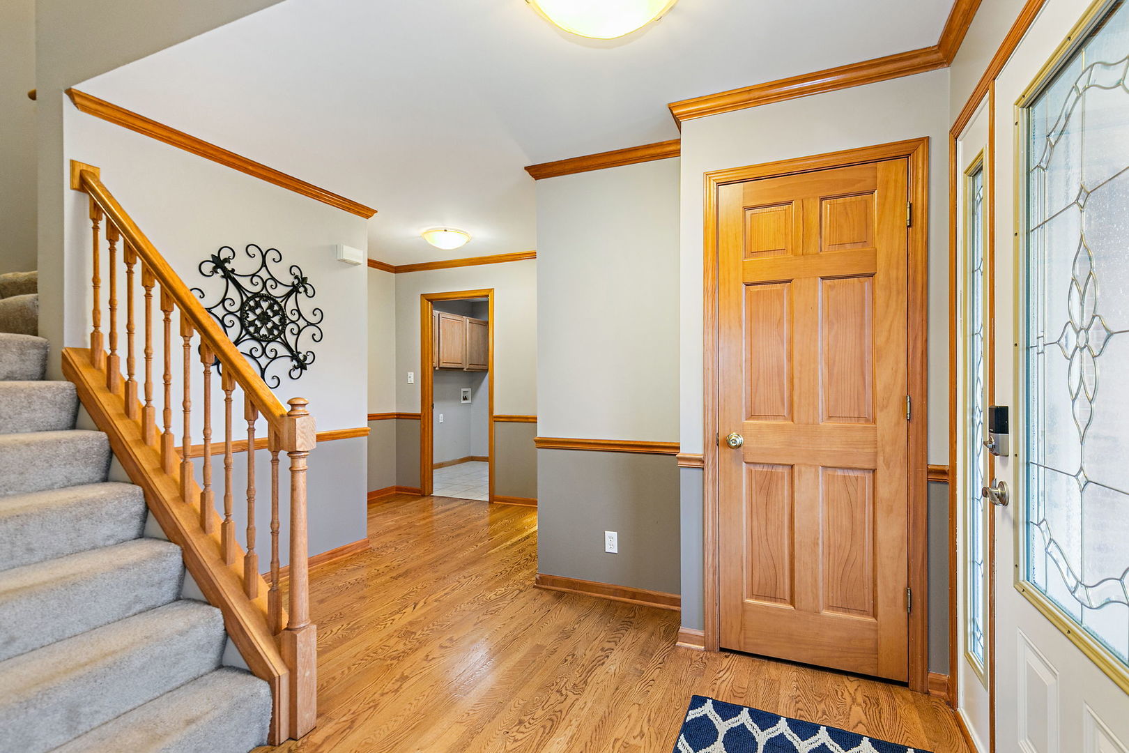 685 Persimmon Street DeKalb, IL 60115 - Photo 4 of 38 a view of a hallway with wooden floor and entryway