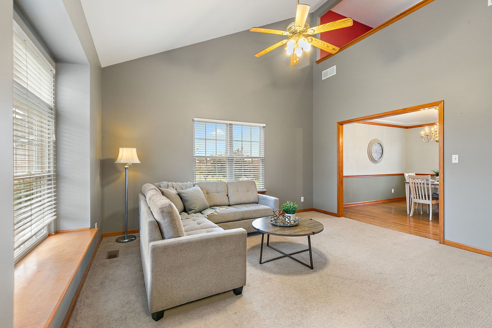 685 Persimmon Street DeKalb, IL 60115 - Photo 5 of 38 a living room with furniture and a chandelier