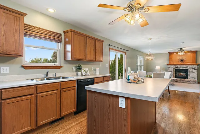 a kitchen with a sink cabinets and window