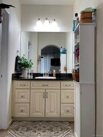 a white toilet sitting next to a bathroom sink