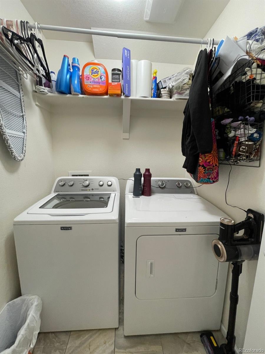 12948 Grant Circle East, Unit B Thornton, CO 80241 - Photo 22 of 24 a utility room with dryer and washer