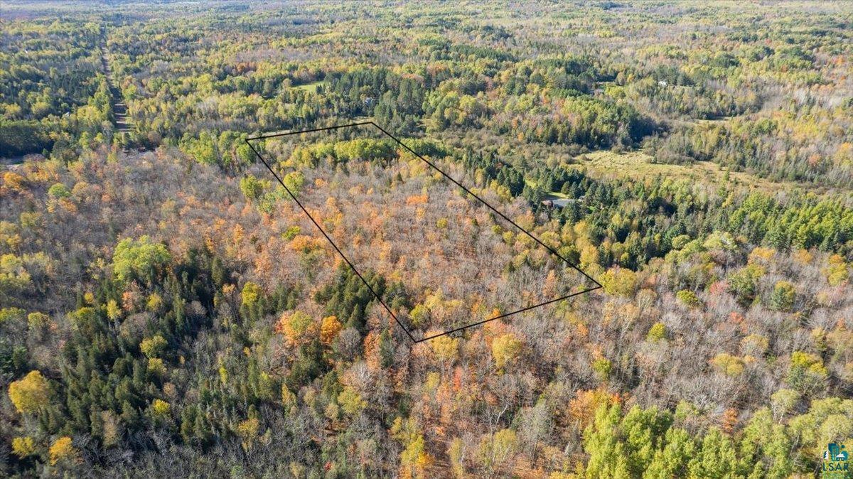 5570 Lester River Road Duluth, MN 55804 - Photo 5 of 11 Aerial overview of property's location featuring property parcel outlined and a heavily wooded area