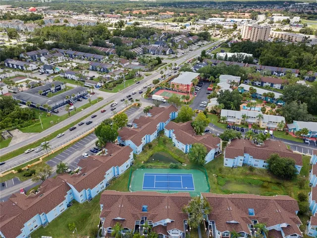 an aerial view of residential houses with outdoor space