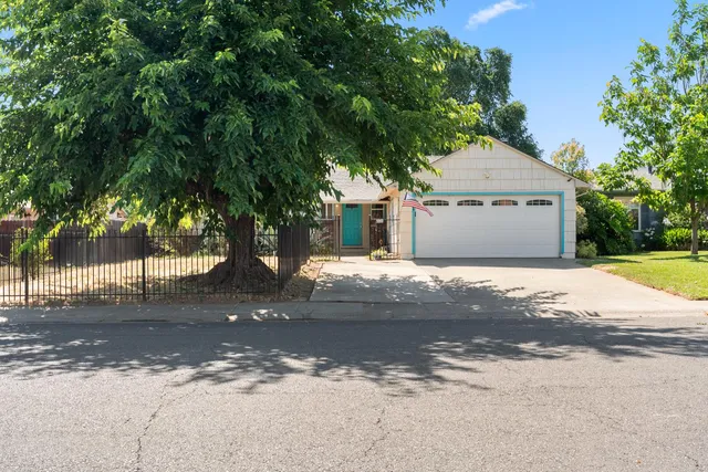 a view of a house with a tree