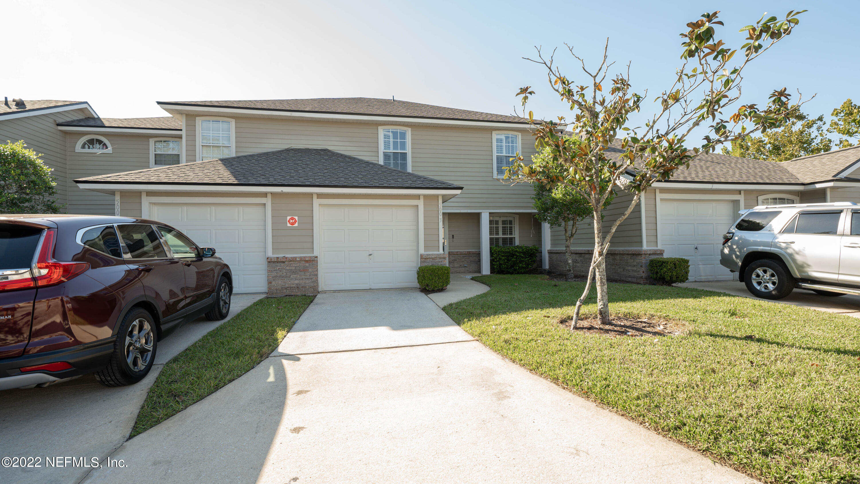 500 South Steel Bridge Road, Unit 3 St. Johns, FL 32259 - Photo 1 of 43 a front view of a house with a garden