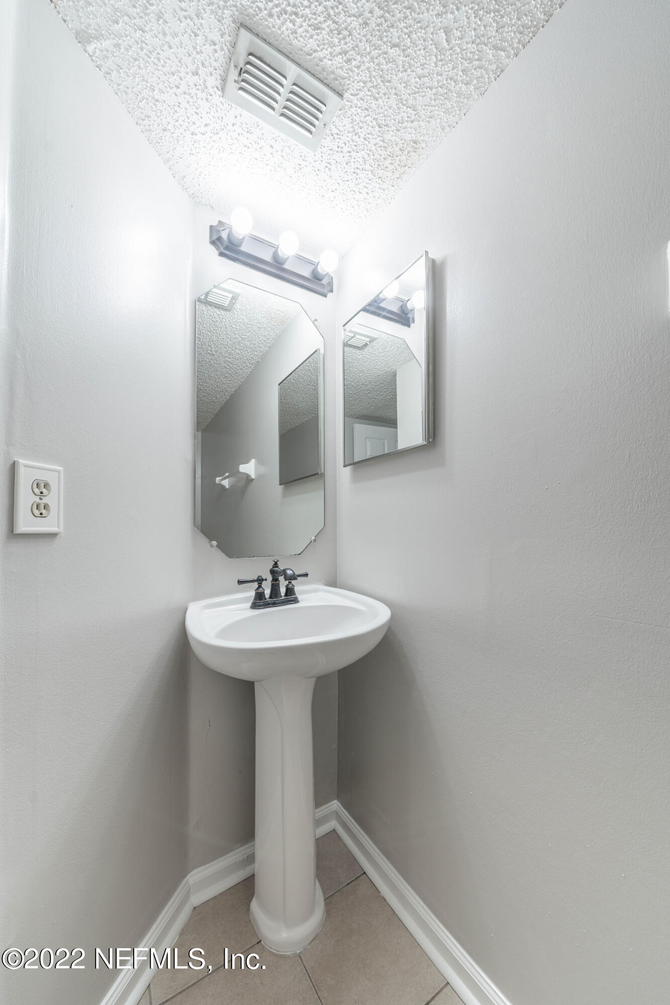 500 South Steel Bridge Road, Unit 3 St. Johns, FL 32259 - Photo 14 of 43 a bathroom with a sink a mirror and vanity