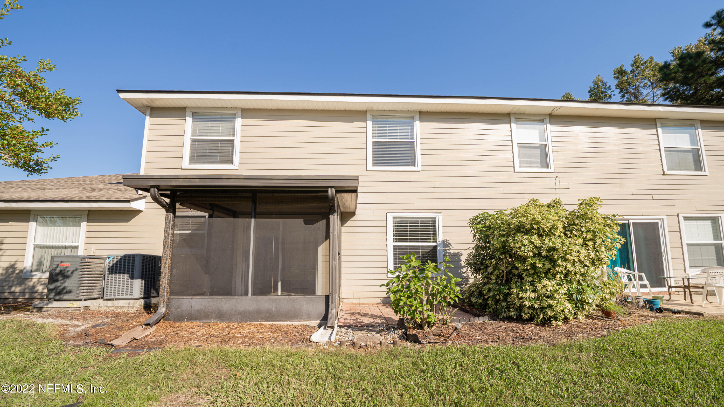 500 South Steel Bridge Road, Unit 3 St. Johns, FL 32259 - Photo 16 of 43 a front view of a house with a yard