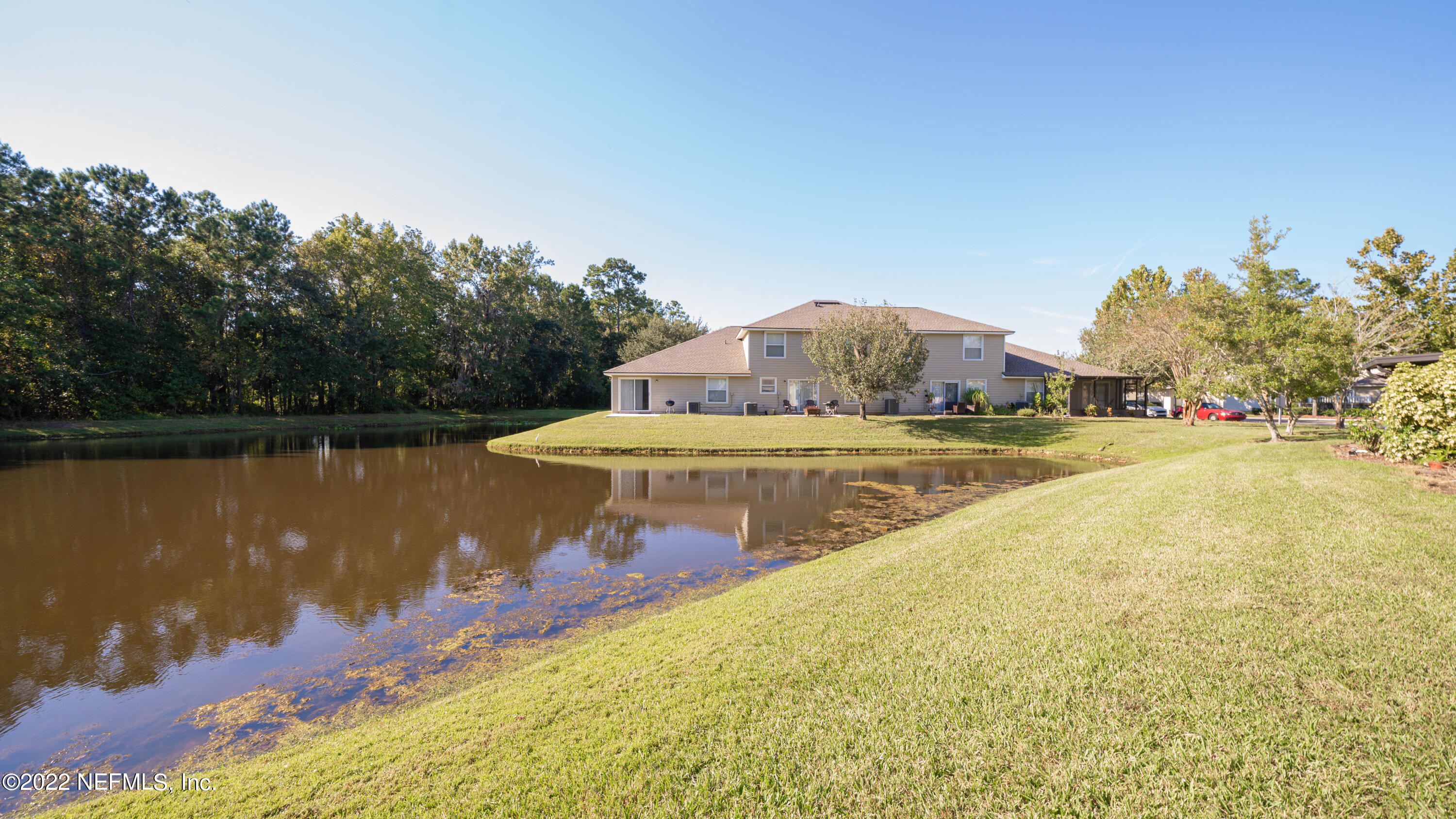 500 South Steel Bridge Road, Unit 3 St. Johns, FL 32259 - Photo 17 of 43 a view of a lake from a yard