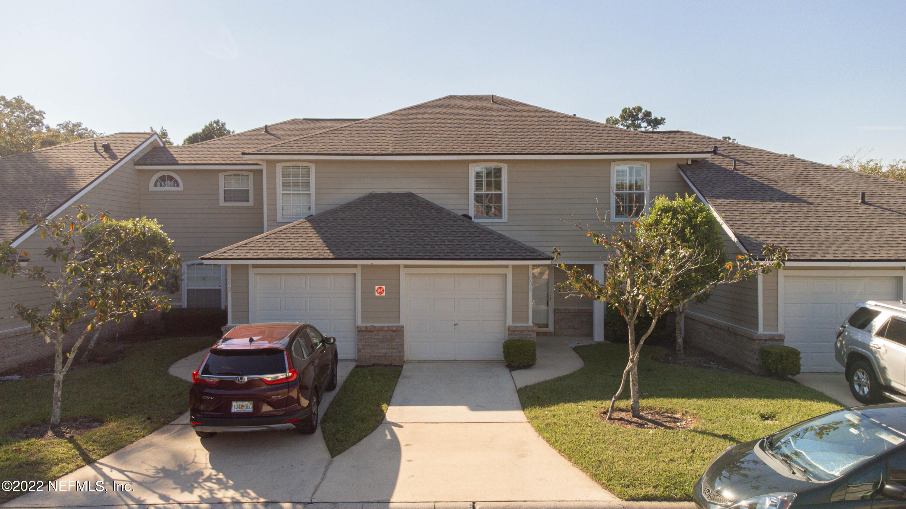 500 South Steel Bridge Road, Unit 3 St. Johns, FL 32259 - Photo 2 of 43 a view of a house with a small yard and potted plants