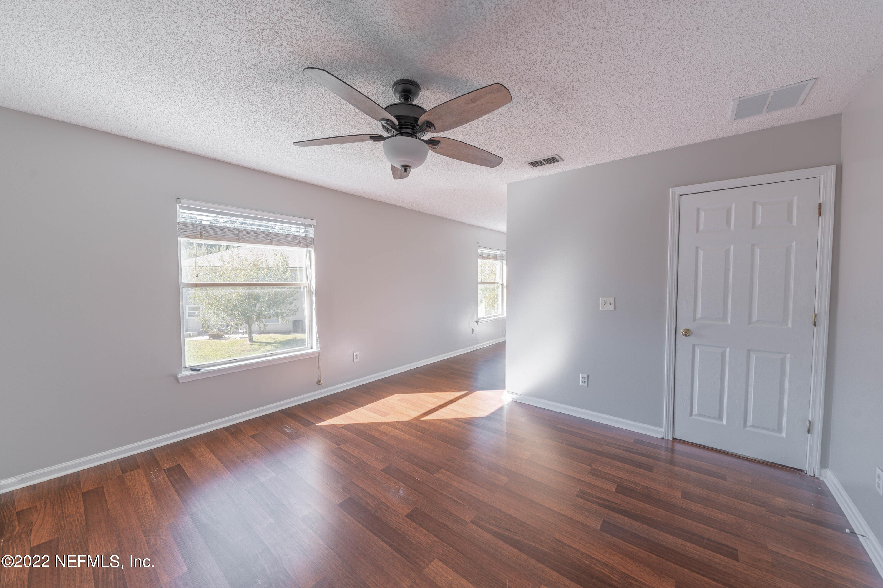 500 South Steel Bridge Road, Unit 3 St. Johns, FL 32259 - Photo 25 of 43 a view of an empty room with wooden floor and a window