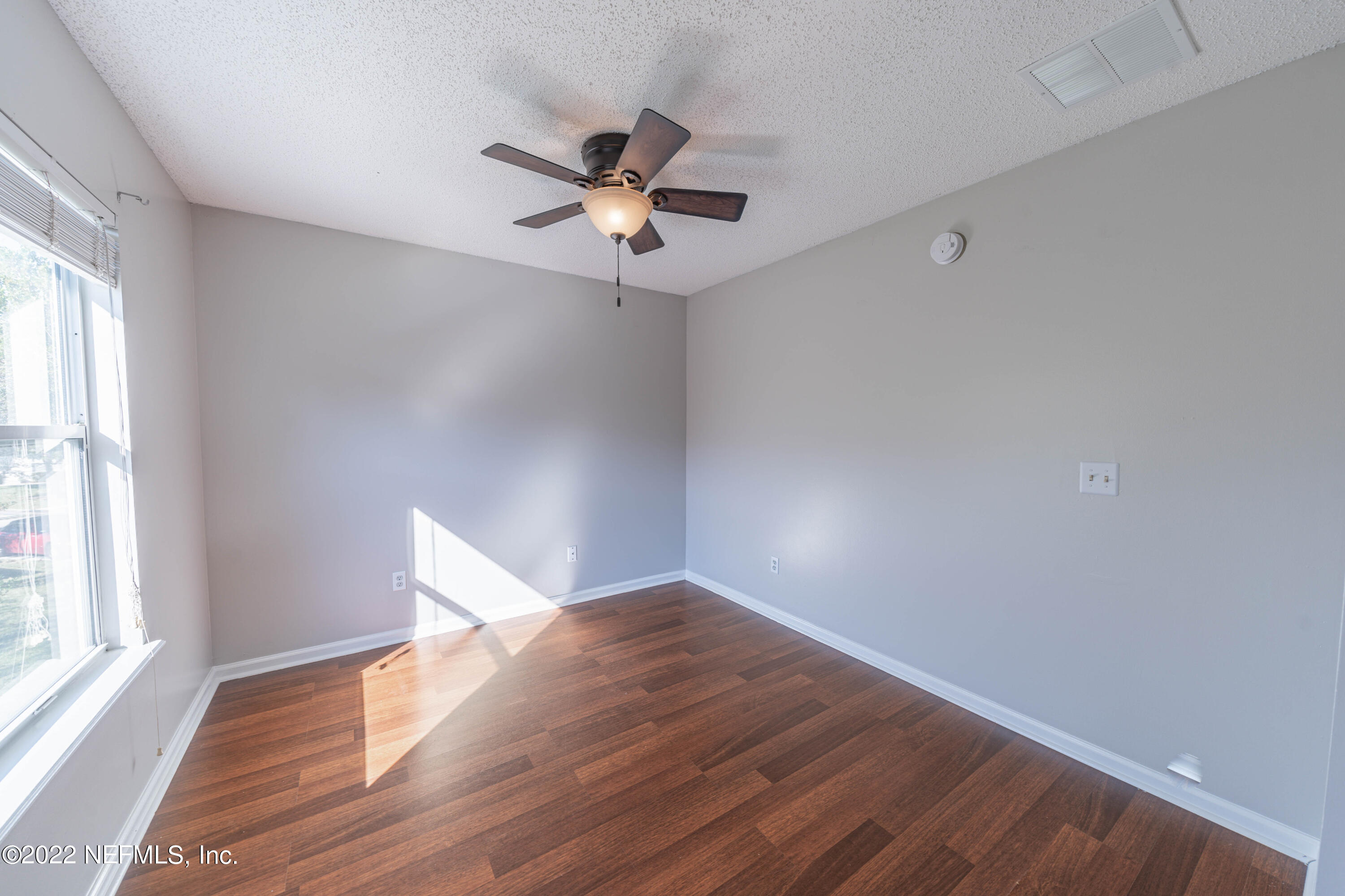 500 South Steel Bridge Road, Unit 3 St. Johns, FL 32259 - Photo 27 of 43 a view of empty room with wooden floor and fan