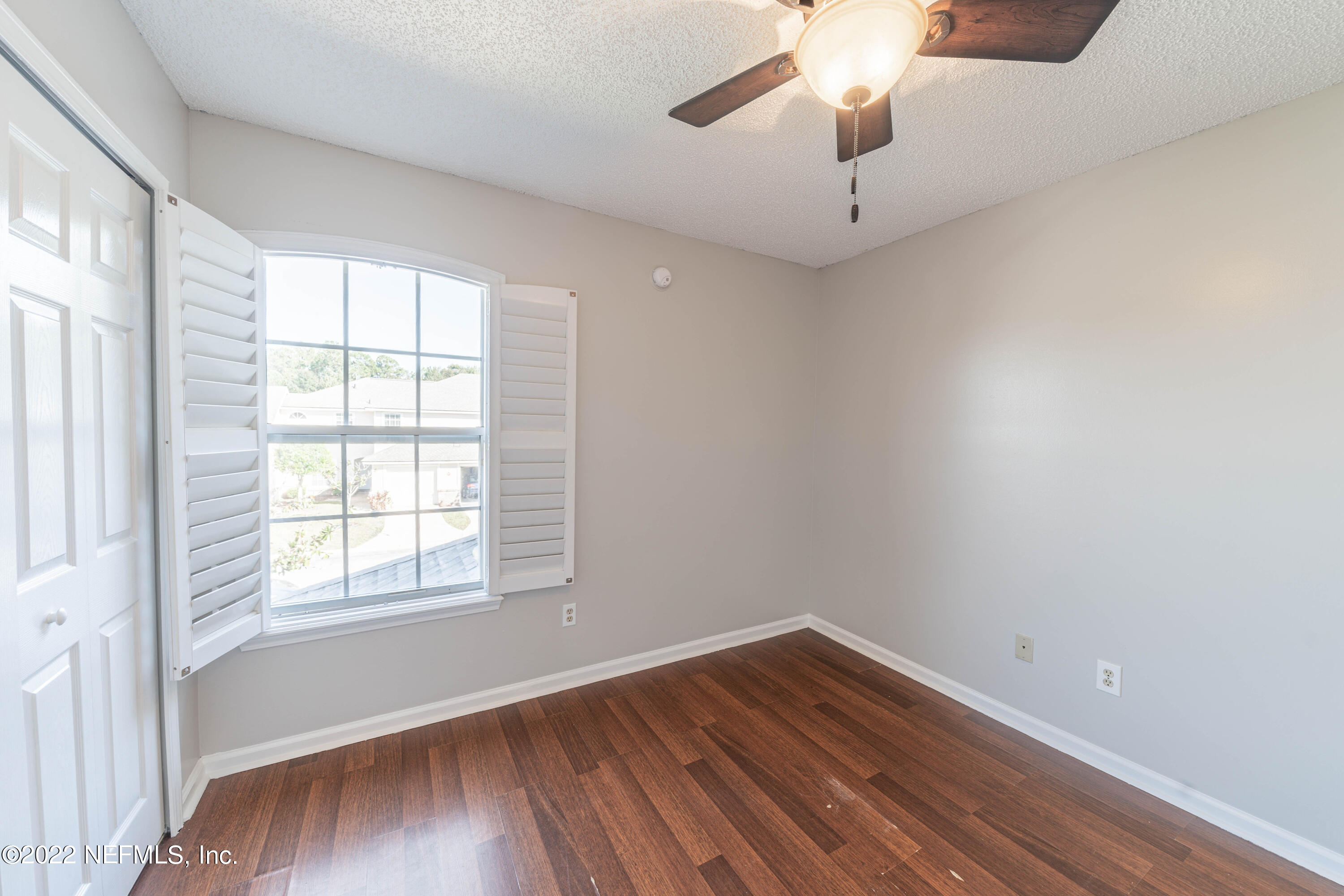 500 South Steel Bridge Road, Unit 3 St. Johns, FL 32259 - Photo 31 of 43 a view of an empty room with wooden floor and a window