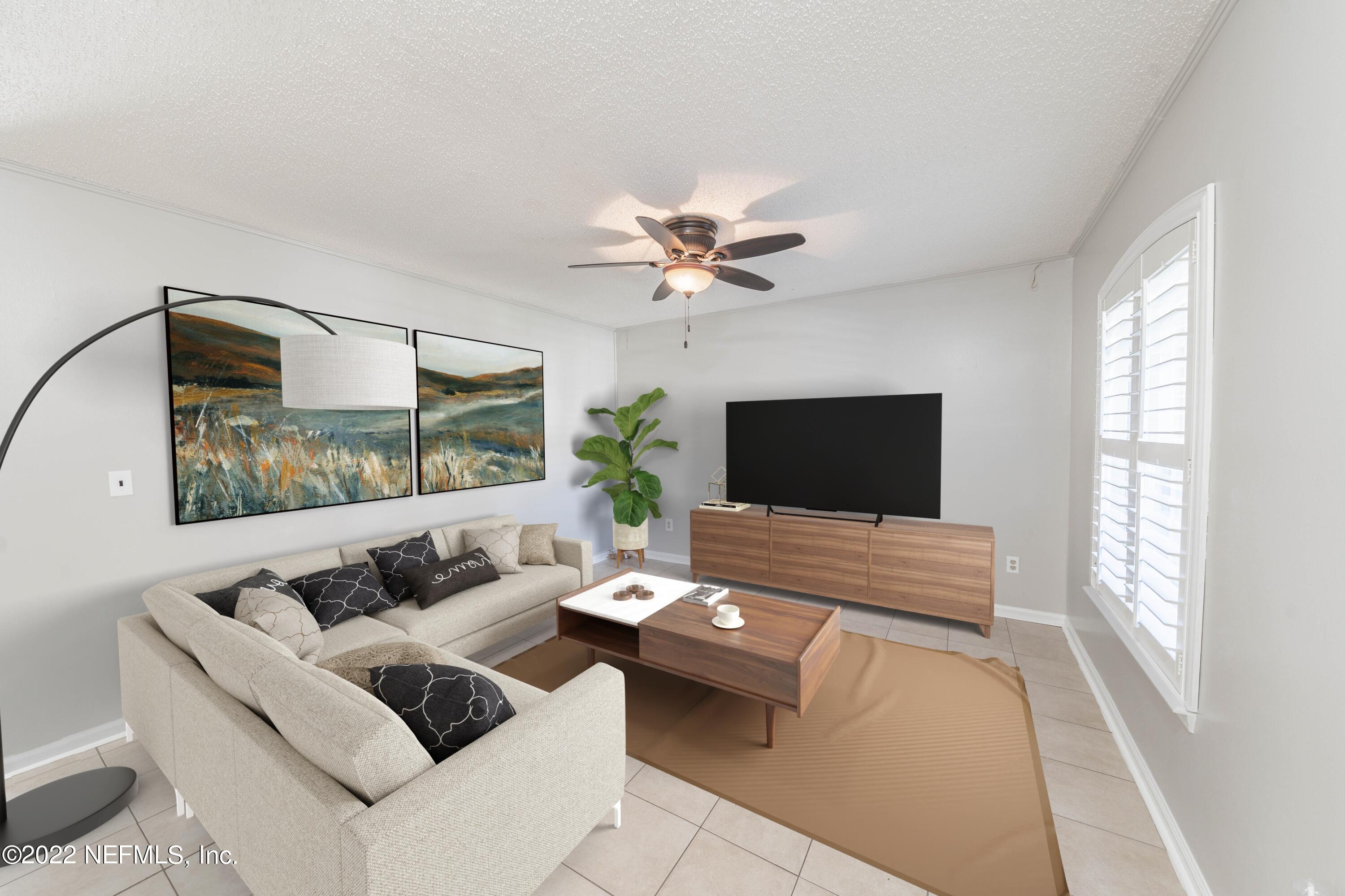 500 South Steel Bridge Road, Unit 3 St. Johns, FL 32259 - Photo 33 of 43 a living room with furniture and a flat screen tv