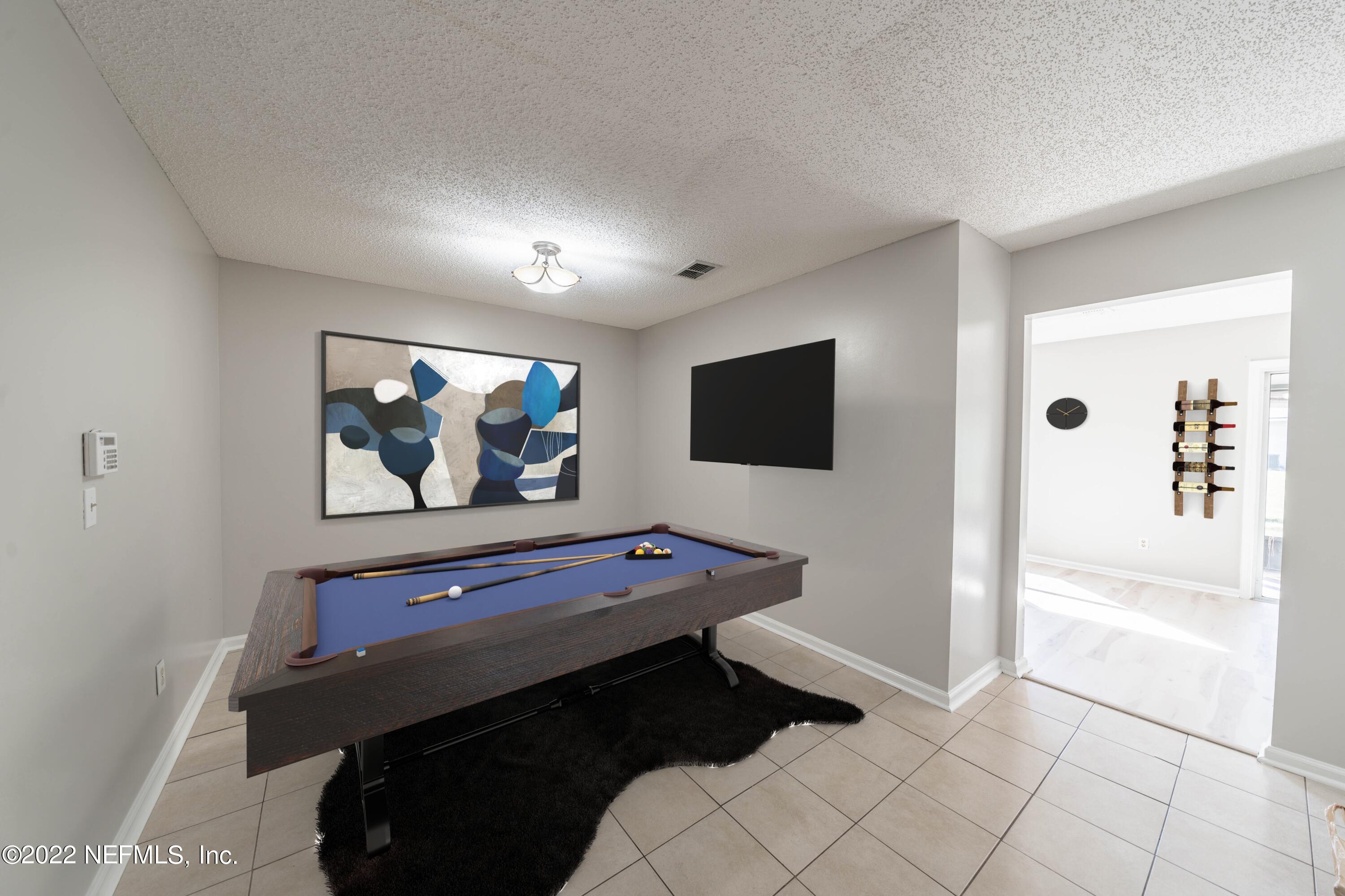 500 South Steel Bridge Road, Unit 3 St. Johns, FL 32259 - Photo 34 of 43 a living room with furniture and a flat screen tv