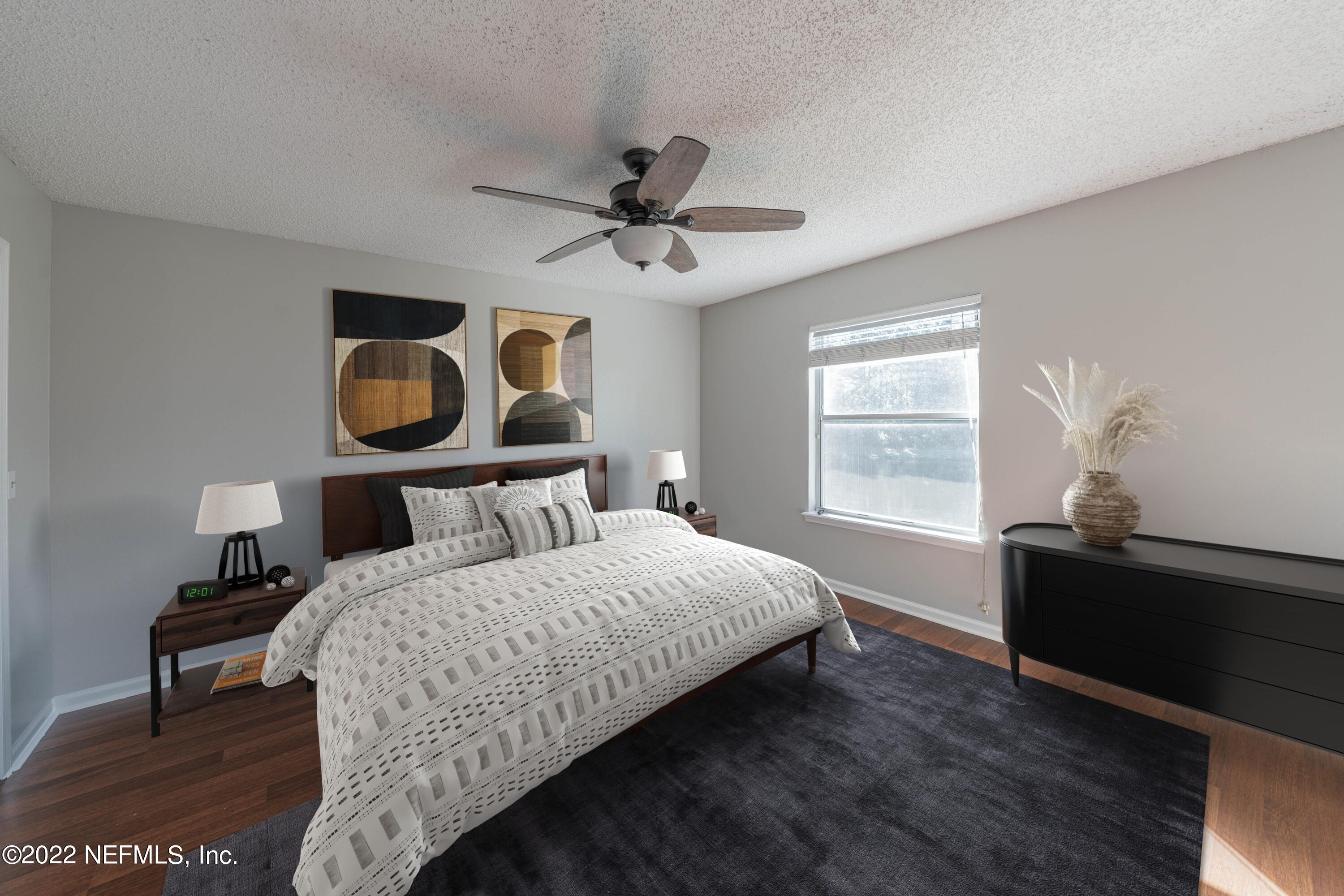 500 South Steel Bridge Road, Unit 3 St. Johns, FL 32259 - Photo 37 of 43 a bedroom with a bed and wooden floor