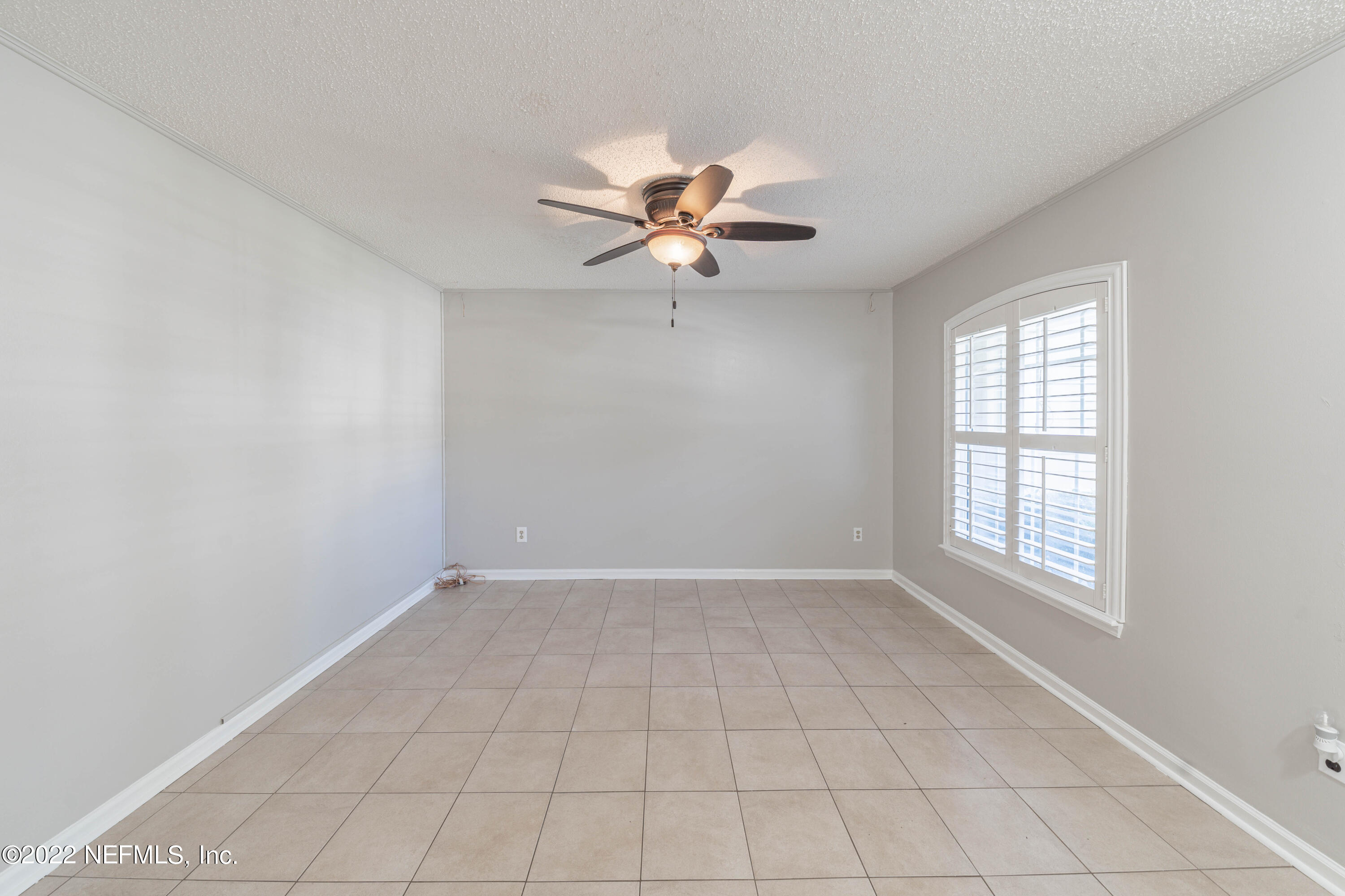 500 South Steel Bridge Road, Unit 3 St. Johns, FL 32259 - Photo 6 of 43 an empty room with fan and windows